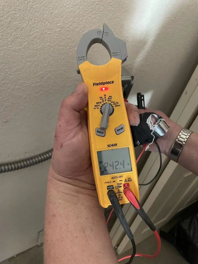 Voltage testing with clamp meter during Outlet Installation in Summerville
